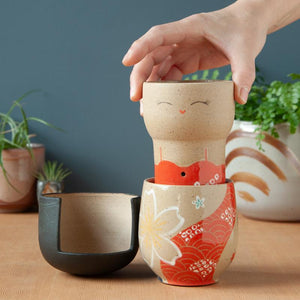 Three vases of varying height with colorful designs.
